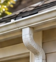Gutter and downspout at the roof edge